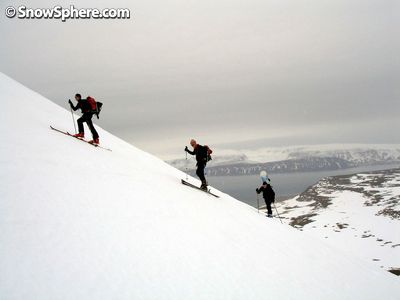 hiking a mountain on skis in iceland